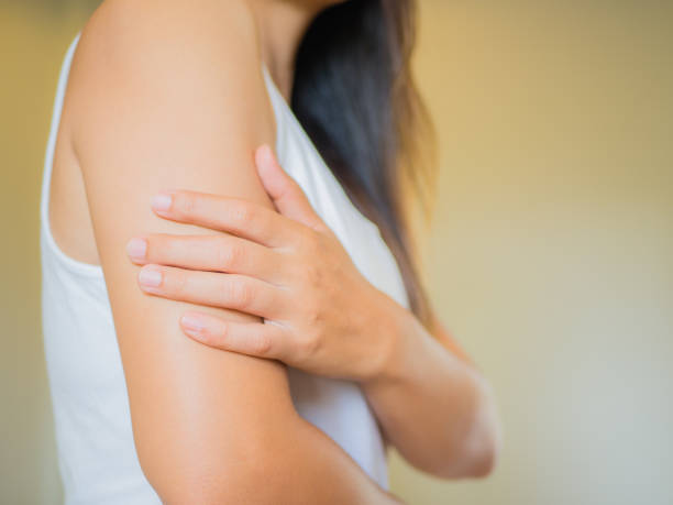 Closeup female's arm. Arm pain and injury. Health care and medical concept. Closeup female's arm. Arm pain and injury. Health care and medical concept. high section stock pictures, royalty-free photos & images