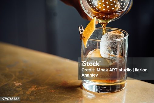 istock Closeup Glass with Alcohol in Cocktail Bar 974765782