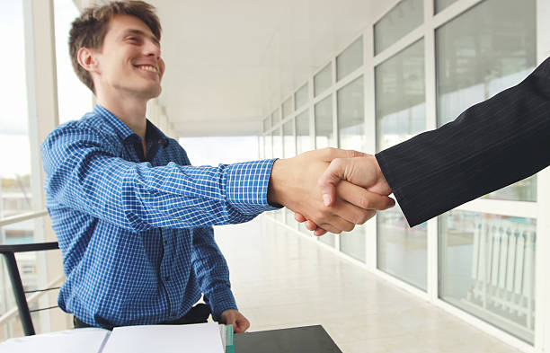Close-up image handshake standing for a trusted partnership stock photo