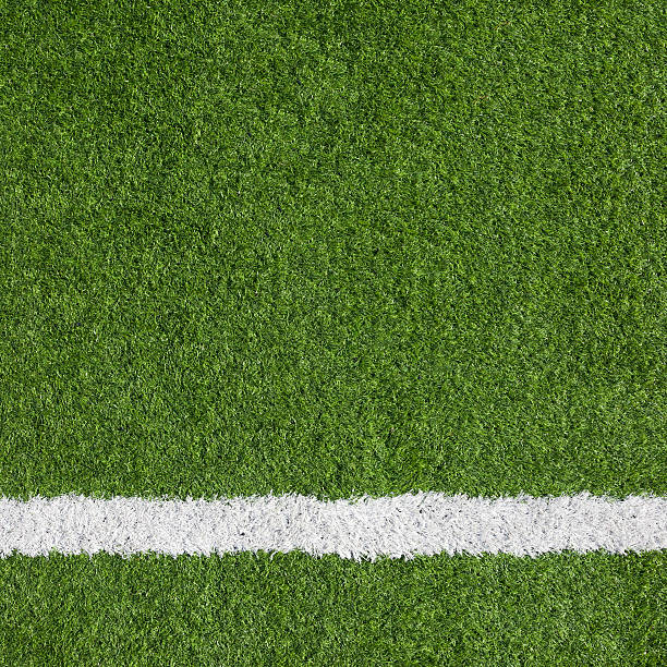 close-up of a boundary line on a soccer field - grass texture stockfoto's en -beelden