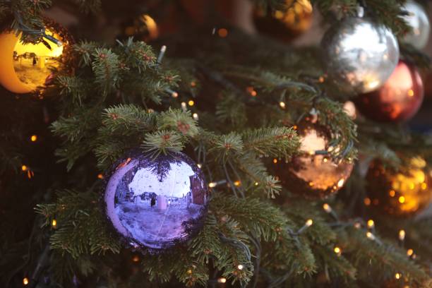 Close-up of a Christmas tree with beautiful balls and decorative lights A close-up of a Christmas tree with beautiful balls and decorative lights virtual background stock pictures, royalty-free photos & images