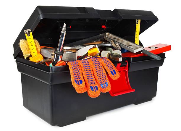 A close-up of a full black toolbox on a white background stock photo