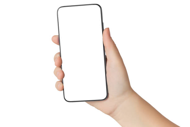 Close-up of a girl's hand holding a modern smartphone with a blank screen. Isolated on white background. stock photo