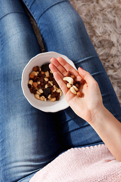 Closeup of a handful healthy snack of nuts stock photo