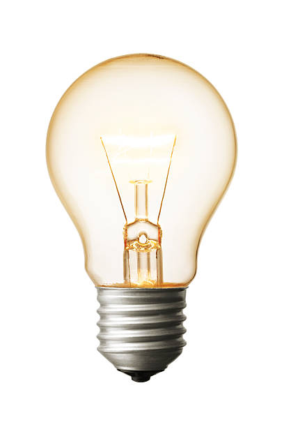 A close-up of a light bulb on a white background glowing lightbulb isolated on white background electric lamp photos stock pictures, royalty-free photos & images