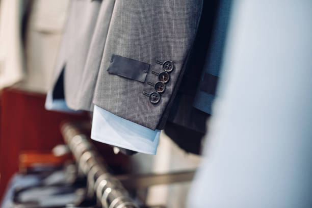 Closeup of a men's suit with textile label and buttons stock photo