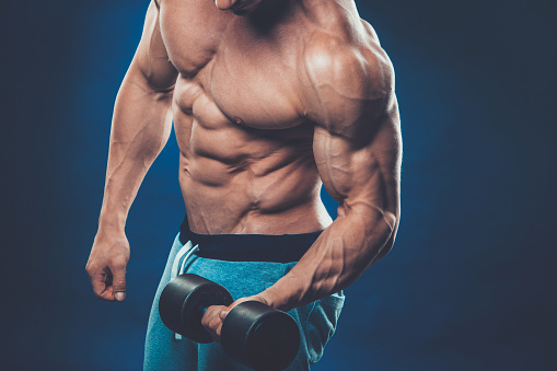 Closeup Of A Muscular Young Man Lifting Dumbbells Weights On Stock ...