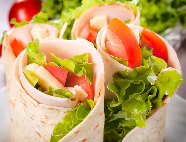 A closeup of a salad filled tortilla wrap stock photo