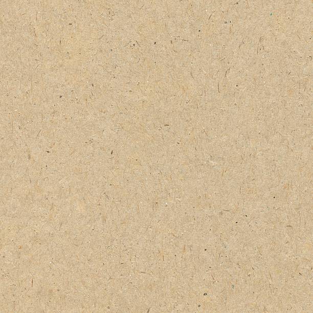 Close-up of a seamless brown recycled paper background Brown recycled paper brown paper stock pictures, royalty-free photos & images