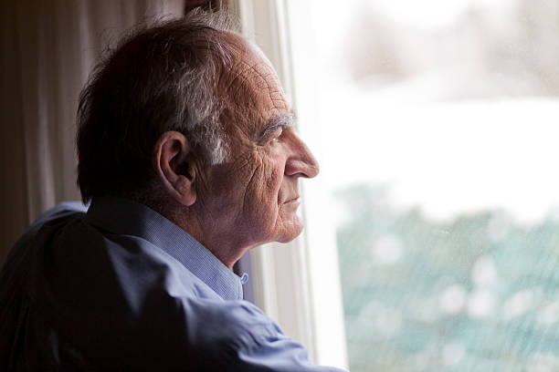 Close-up of a senior man contemplating stock photo