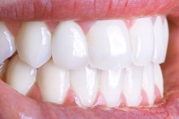 Close-up of a shiny white human teeth stock photo