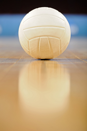 Closeup Of A White Volleyball On A Wooden Floor Stock Photo - Download ...