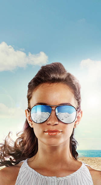 Close-up of a woman on beach in the glasses stock photo