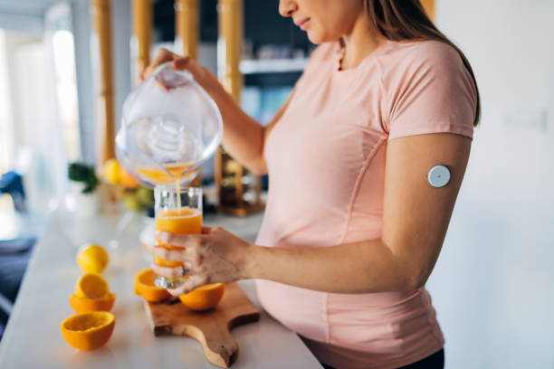 Close-up of a young pregnant woman with diabetes who made lemon juice stock photo