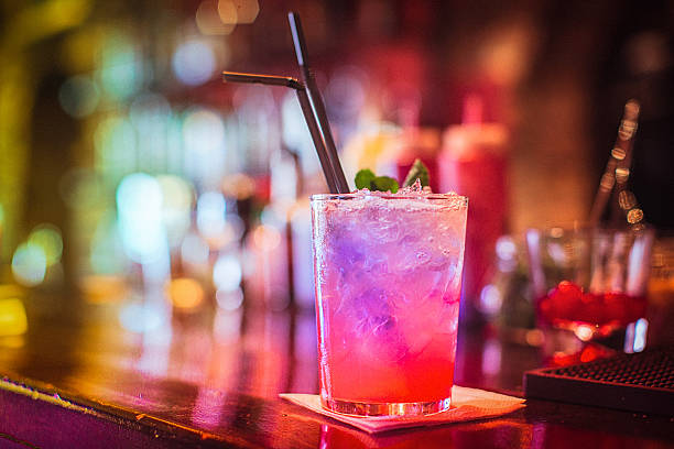 Close-up of alcohol cocktail on the bar counter in nightclub stock photo