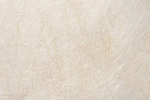 Close-up of hand made beige rice paper texture background.
