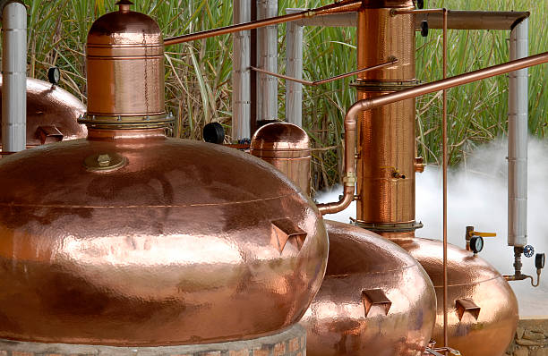 Close-up of copper pots use as a distillery outdoors stock photo