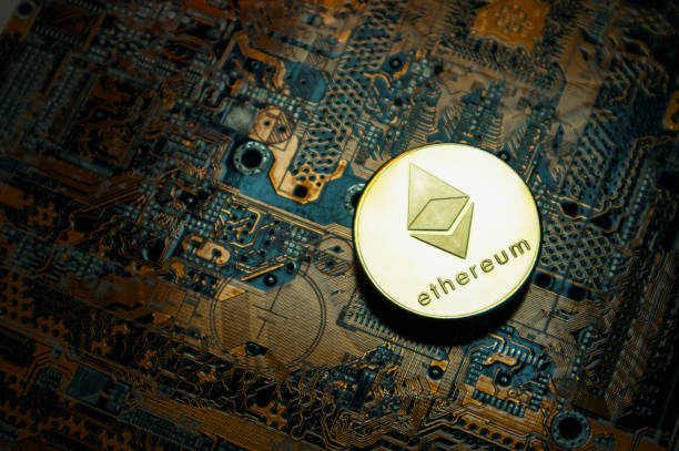 Close-up of Ethereum ETH cryptocurrency over computer circuit stock photo