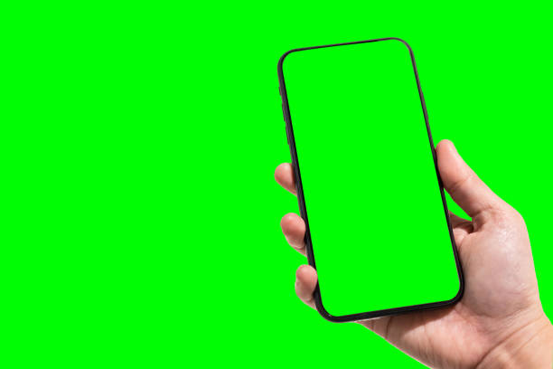 Close-up of female use Hand holding smartphone blurred images touch of green screen background.  female likeness stock pictures, royalty-free photos & images