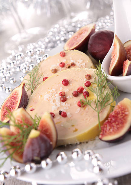 Close-up of Foie Gras decorated with fresh figs and dill foie gras with figs foie gras stock pictures, royalty-free photos & images