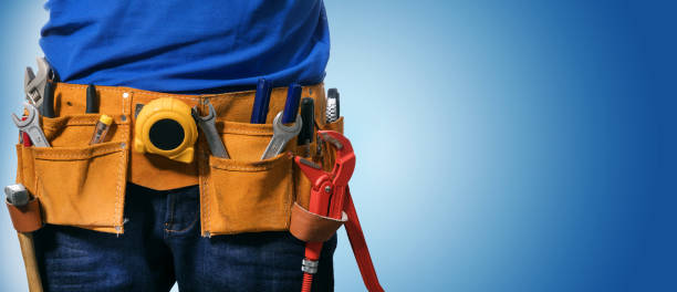 closeup of handyman tool belt on blue background with copy space closeup of handyman tool belt on blue background with copy space tool belt stock pictures, royalty-free photos & images
