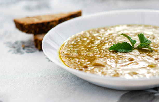 Closeup of lentil soup served in white plate stock photo