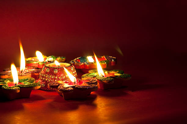 Colorful diyas lit up during Diwali celebration and diwali is the festival of lights.