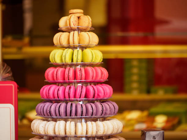 Closeup of macaron tower, Riquewihr, France Closeup detail of multiple colorful macarons arranged on a tower at a French sweets and confectionery store. Shallow focus. Riquewihr, France. Travel and cuisine. riquewihr stock pictures, royalty-free photos & images