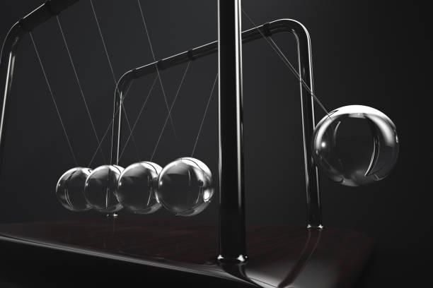 Close-up of Newton's cradle in action stock photo