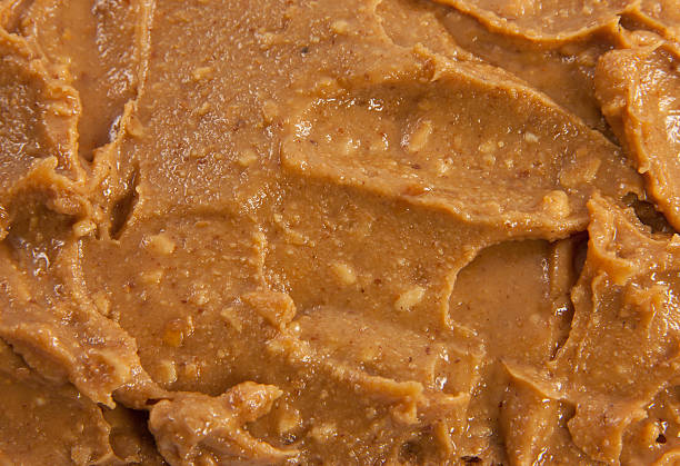 Closeup of peanut butter Picture of a spreaded heap of peanut butter crunchy stock pictures, royalty-free photos & images