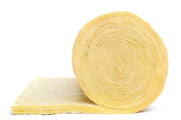 Close-up of roll of fibreglass insulation material on white "Roll of fiberglass insulation material, isolated on white background.Please see some similar aInsulation materialai from my portfolio:" insulation stock pictures, royalty-free photos & images