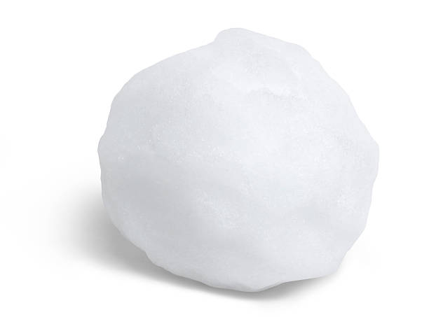 Close-up of round snowball against a white background stock photo