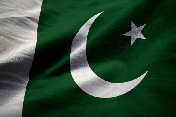 Closeup of Ruffled Pakistan Flag Closeup of Ruffled Pakistan Flag, Pakistan Flag Blowing in Wind pakistani flag stock pictures, royalty-free photos & images