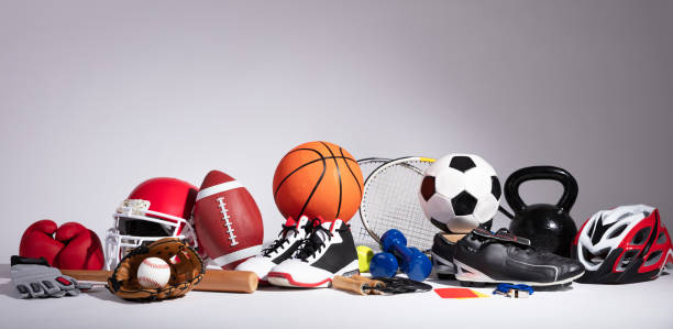 Close-up Of Sport Balls And Equipment Variety Of Sport Balls And Equipment In Front Of Gray Surface competition stock pictures, royalty-free photos & images