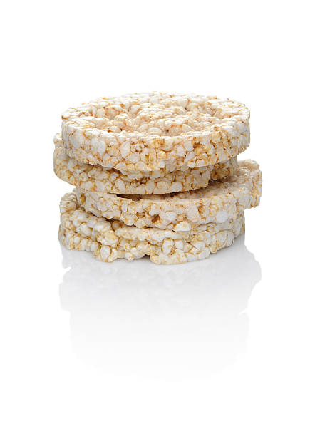 A closeup of stacked rice cakes on a white background stock photo