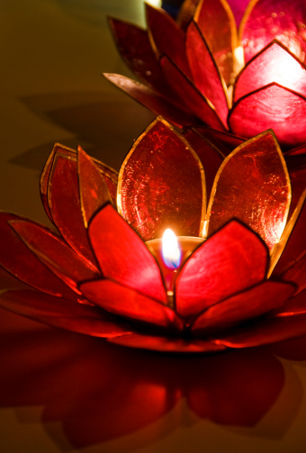 Burning tealights in a lotus shaped candle holder.