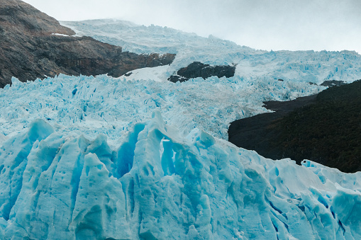 Close-up of the Perito Moreno glacier flowing down from the mountains. Los Glaciares National Park, Patagonia, Argentina