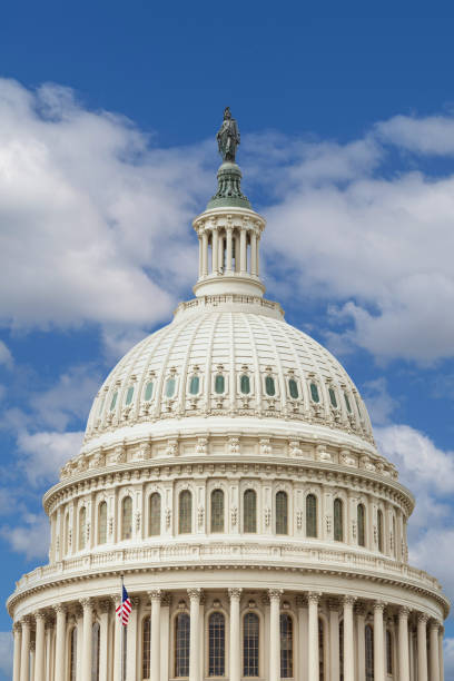 Close-up of the US Capitol Building Dome with Sky with Puffy Clouds in Background, Washington DC, USA. stock photo
