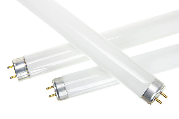Close-up of three fluorescent tubes over a white background stock photo