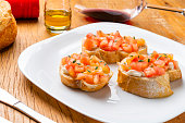 Close-up of traditional Bruschetta with tomato and buffalo cheese.