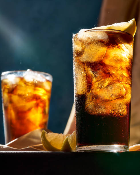 closeup of two glasses of soda with ice served on a wooden table closeup of two glasses of soda with ice served on a wooden table seleccion argentina stock pictures, royalty-free photos & images