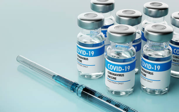 Closeup of vaccine bottles and syringe. 3D render. stock photo