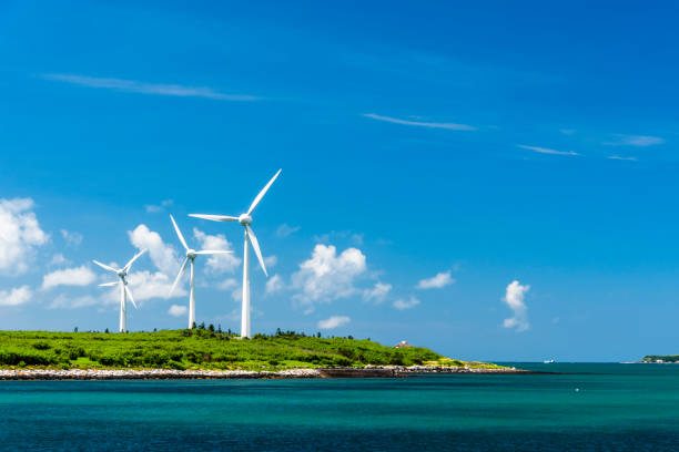 Close-up of windmills group with blue sky stock photo