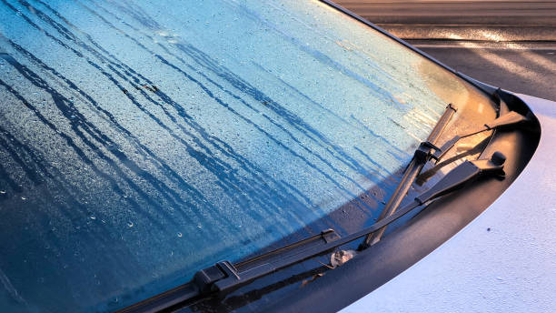 Closeup of windshield wiper covered rain drop in the morning stock photo