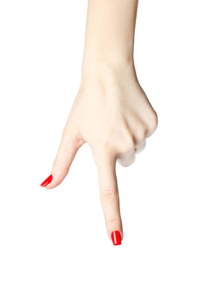 close-up of woman's hand with red nails pointing  index finger on white background. closeup of woman's hand with red nails pointing with index finger on white background. lacquered stock pictures, royalty-free photos & images
