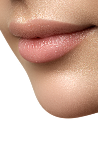 Closeup Of Womans Lips With Fashion Natural Beige Lipstick Mak