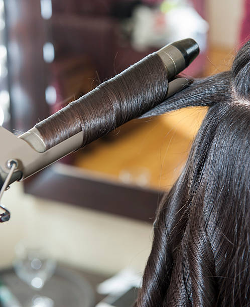 Closeup of womens hair styling stock photo