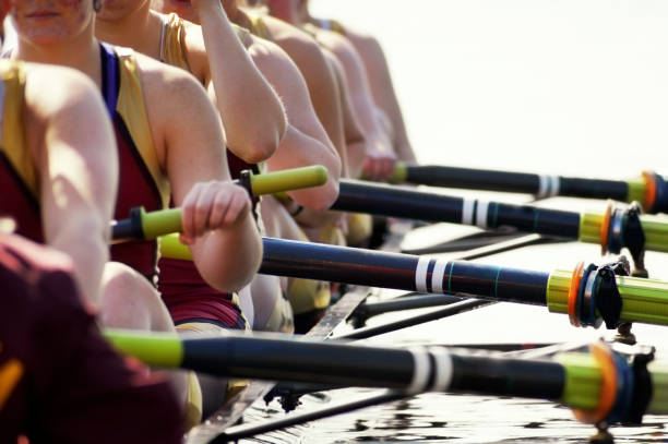 Close-up of women's rowing team blown-out stock photo