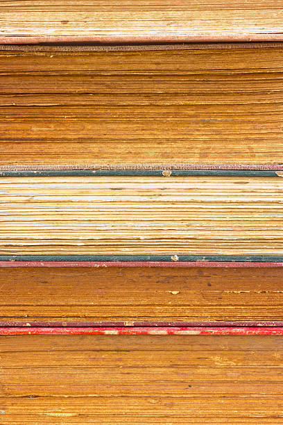 Closeup stack of old book pages texture.