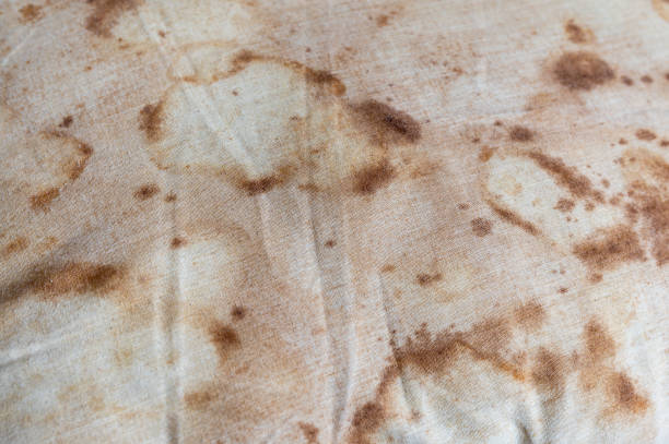 Close-up old dirty pillow with saliva stain and fungus Close-up old dirty pillow with saliva stain and fungus cause of illness bed bug stains stock pictures, royalty-free photos & images